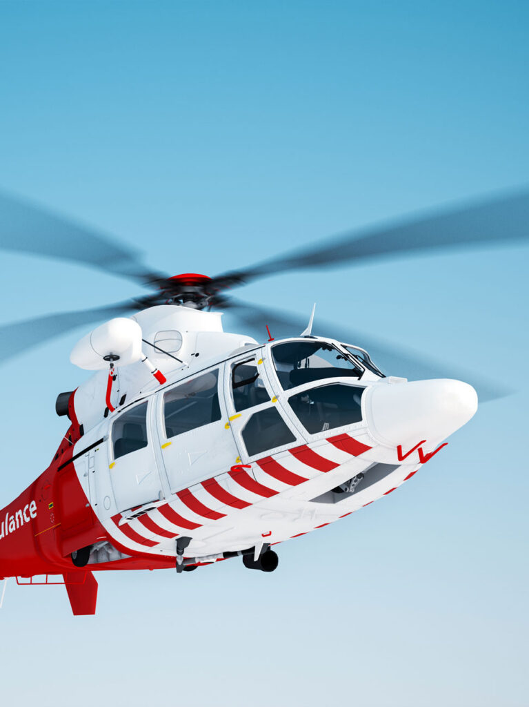 Air ambulance helicopter in flight against a clear blue sky
