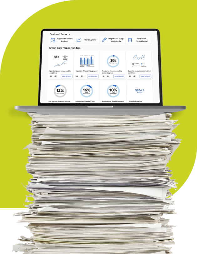 Laptop on a stack of papers
