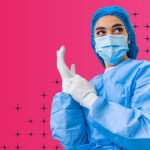 medical worker putting on gloves and mask