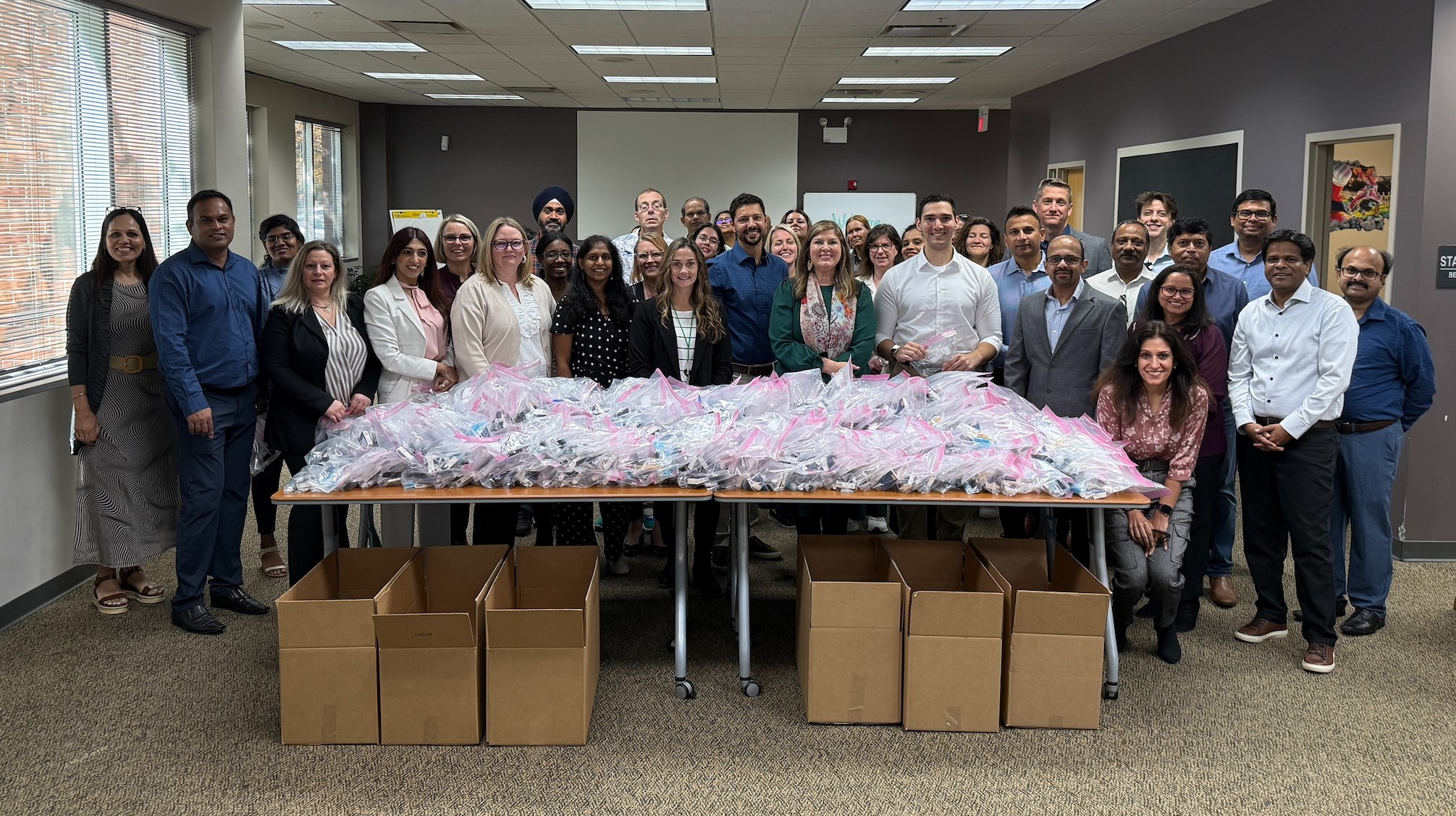 Claritev employees packing donations during the CEO road show in Naperville