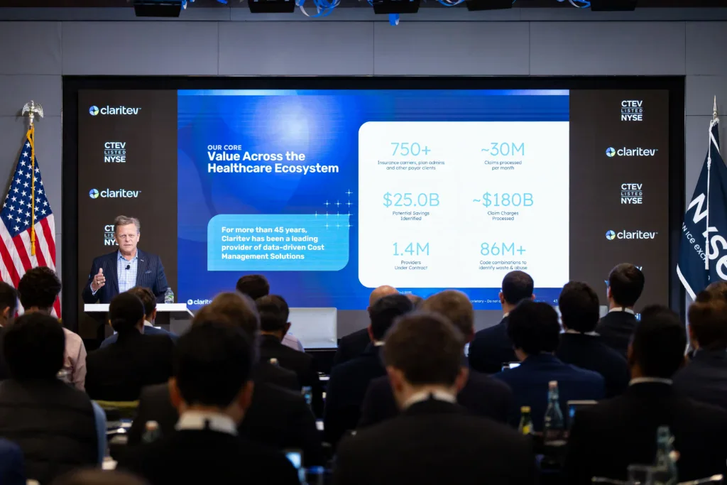 Audience watching a Claritev presentation titled Value Across the Healthcare Ecosystem