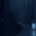 car driving on winding road in the dark